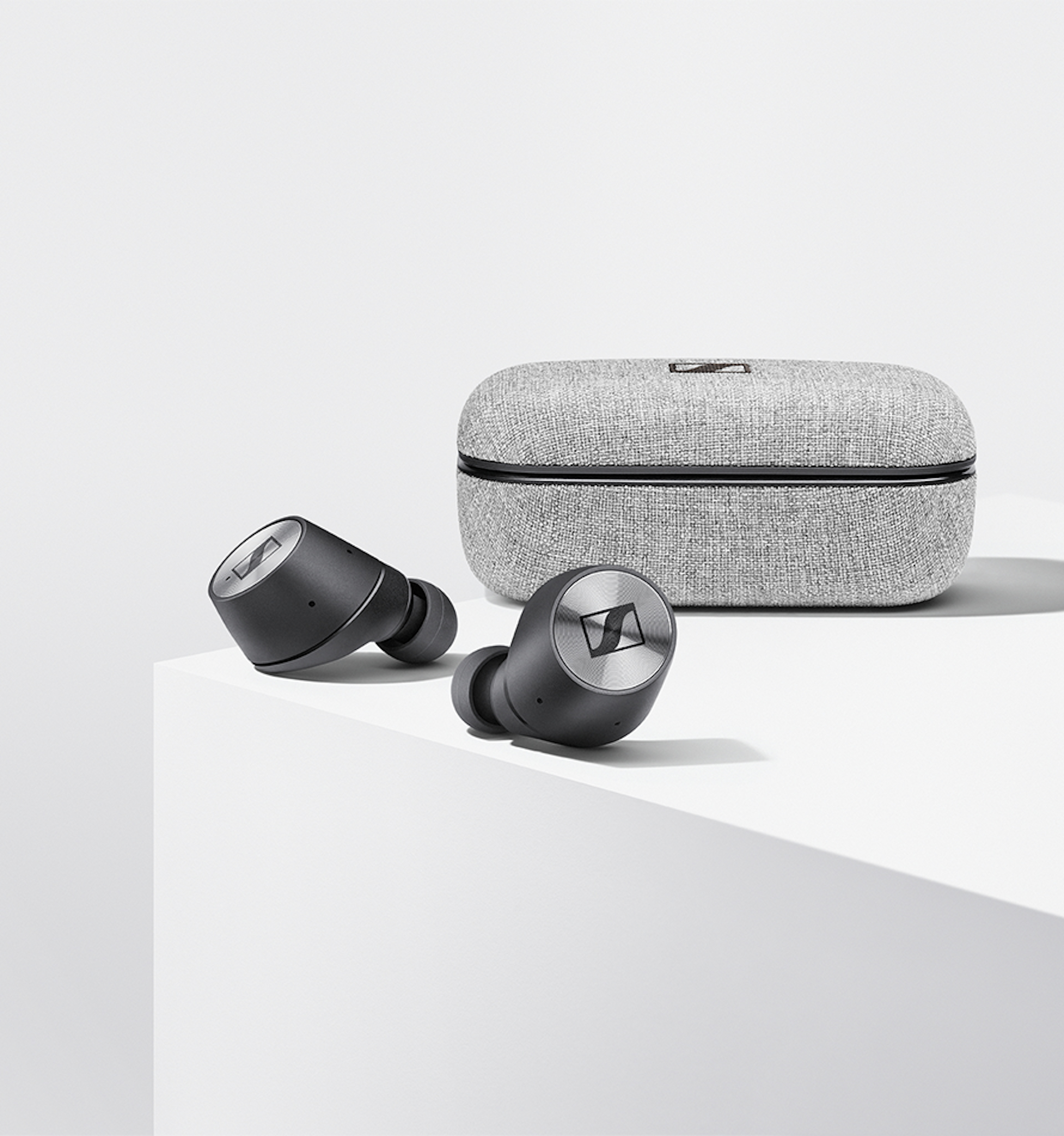 Men wearing MOMENTUM True Wireless Earbuds