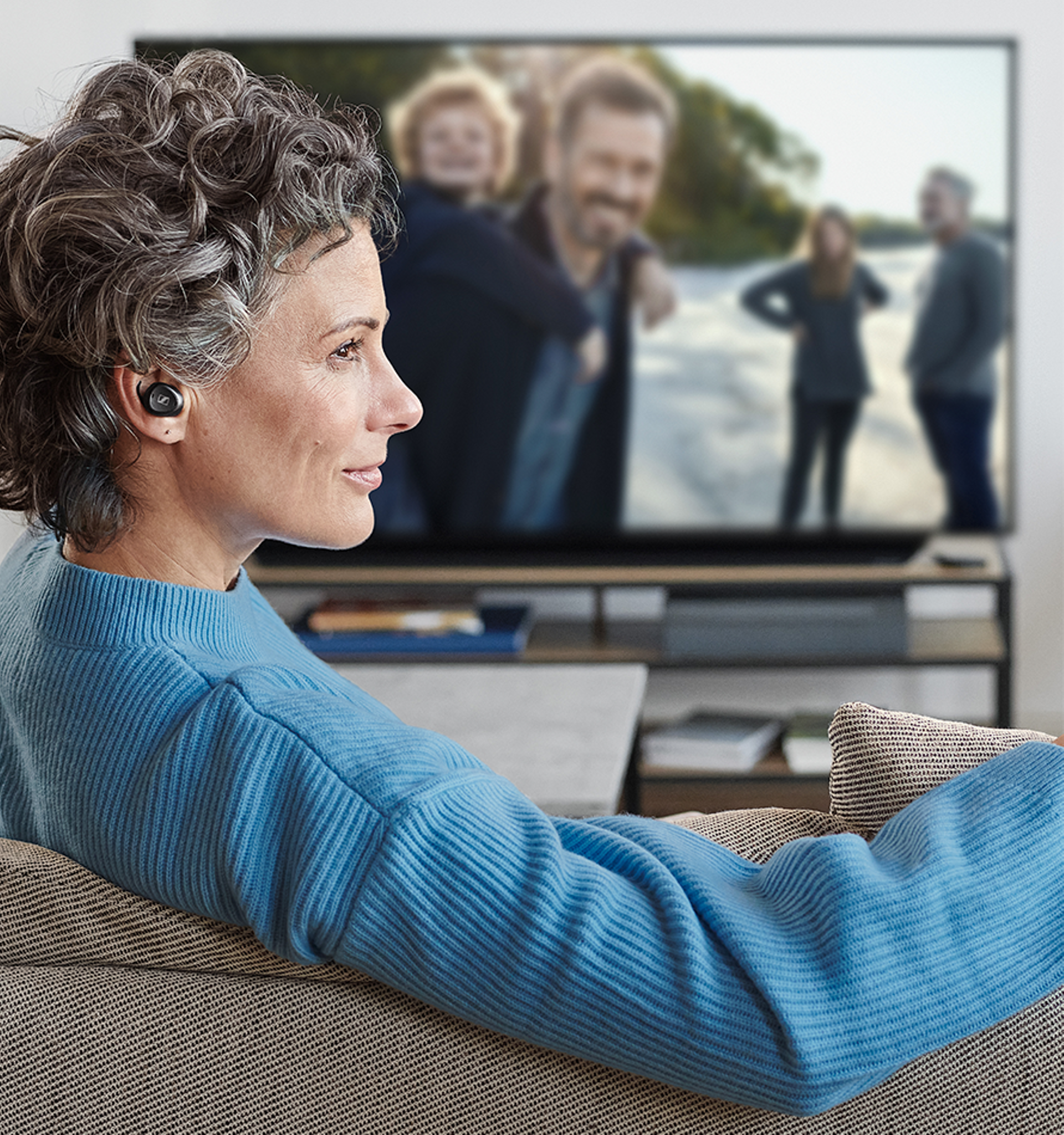 woman hearing with TV Clear and watching TV