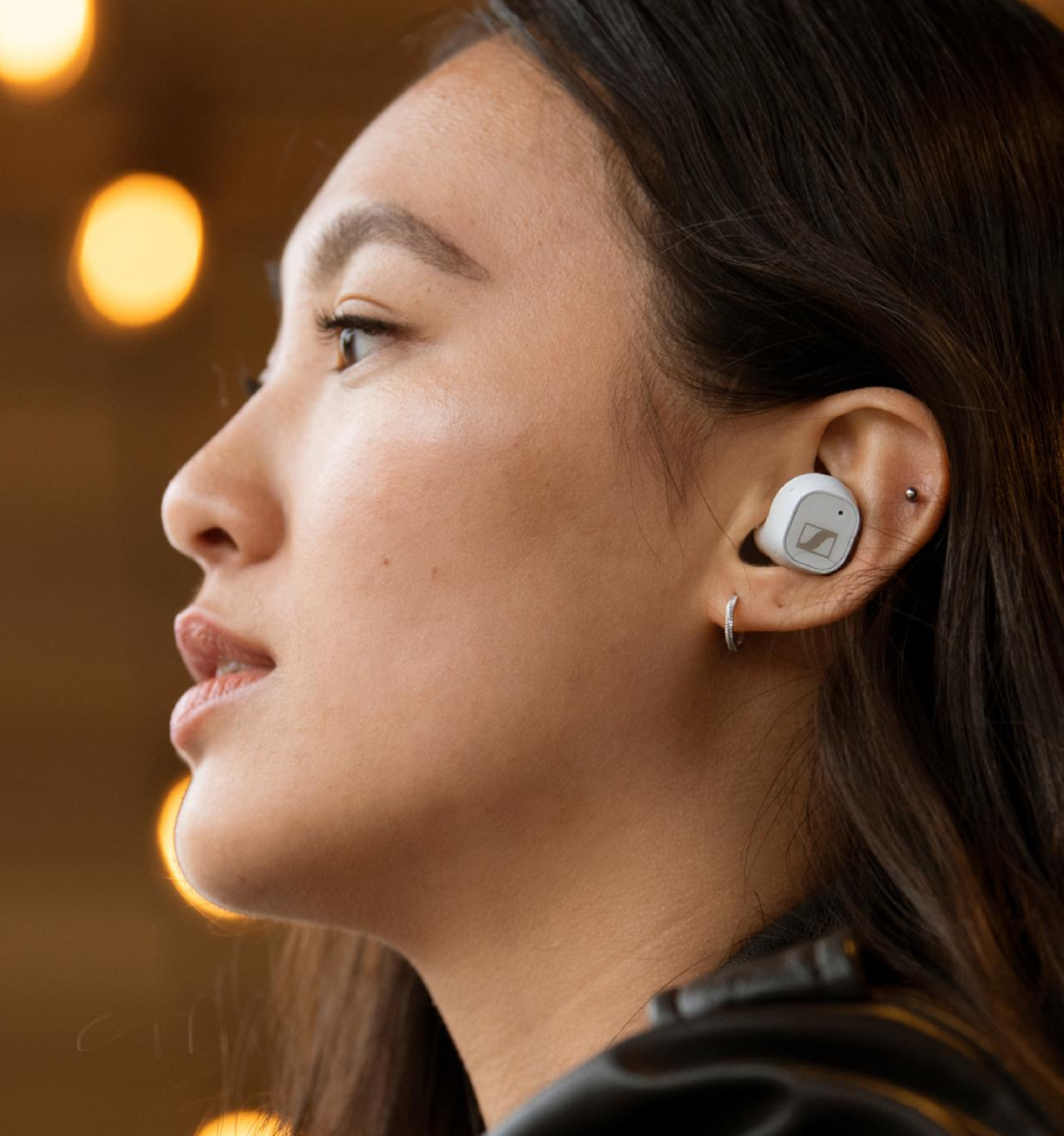 Woman wearing  white CX Plus True Wireless Sennheiser Earbuds